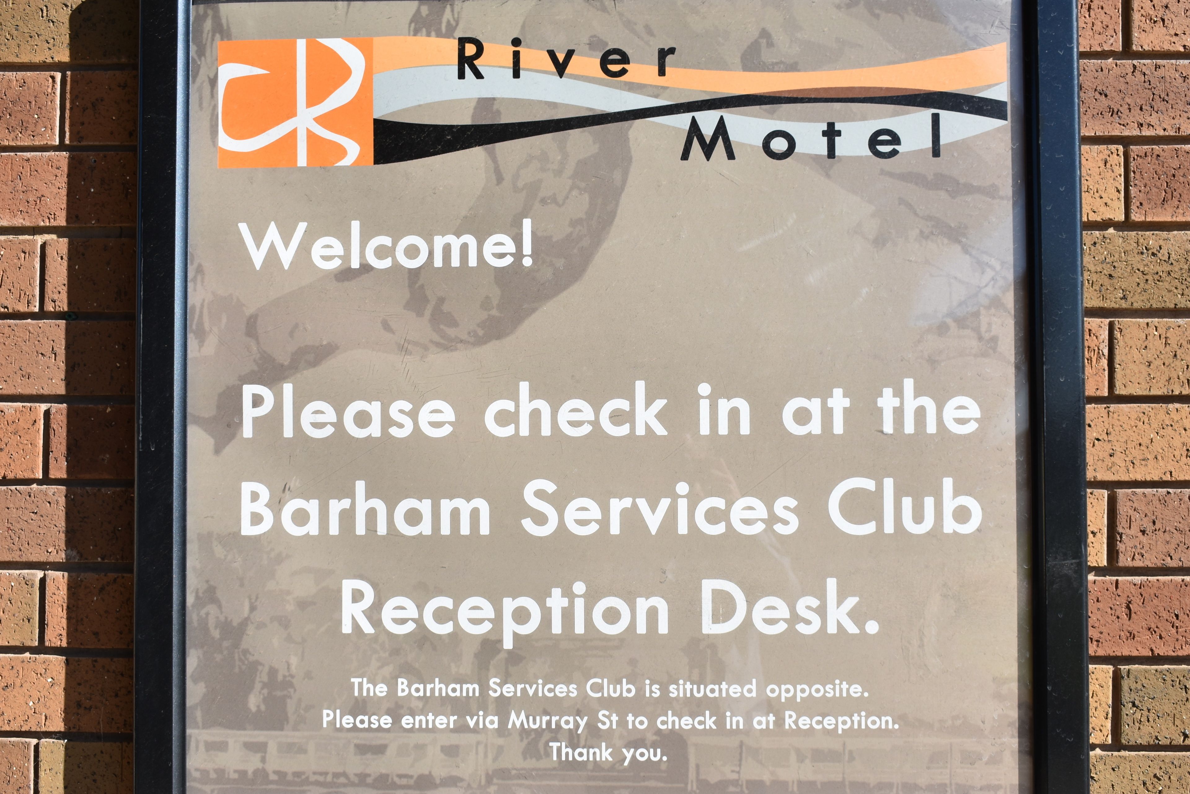 A welcome sign for River Motel with instructions to check in at the Barham Services Club Reception Desk.