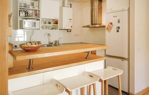 Fridge, stovetop, dishwasher, coffee/tea maker
