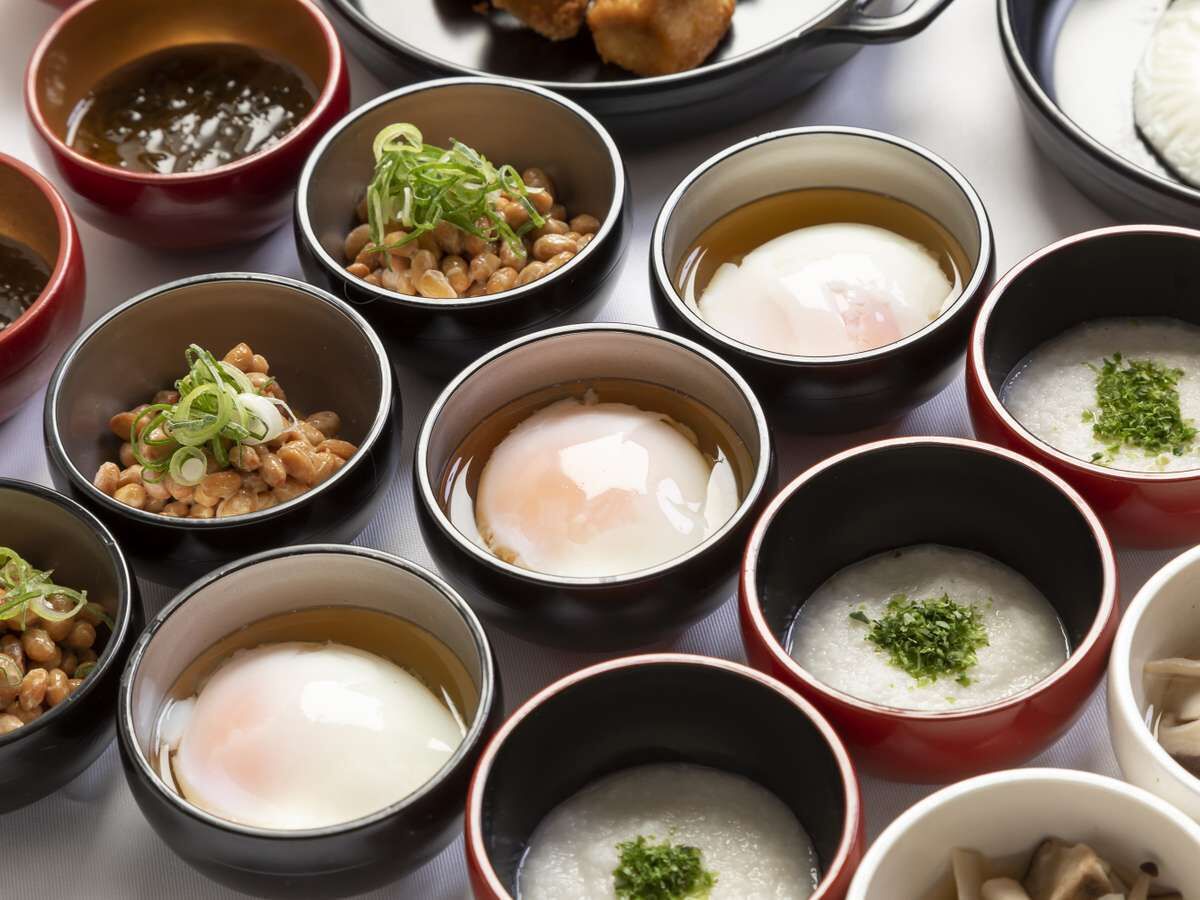 A variety of bowls containing different food items, likely part of a meal or snack selection.