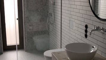 Shower, hair dryer, towels, toilet paper