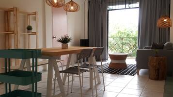 Apartment, 2 Bedrooms, Balcony | Living area | LED TV, pay films