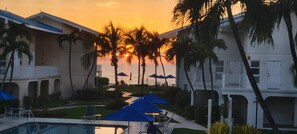 Outdoor pool, a heated pool - Cayman Reef Resort, Seven Mile Beach. 3 Bed 2 Bath Condo, with Pool & Tennis (George Town)