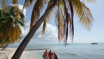 On the beach, sun-loungers, beach towels