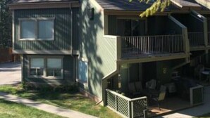 A two-story house with a balcony and a chimney. - Private beach and lake access at Windermere Lake. NEW POOL AND HOT TUB NOW OPEN! (Windermere)