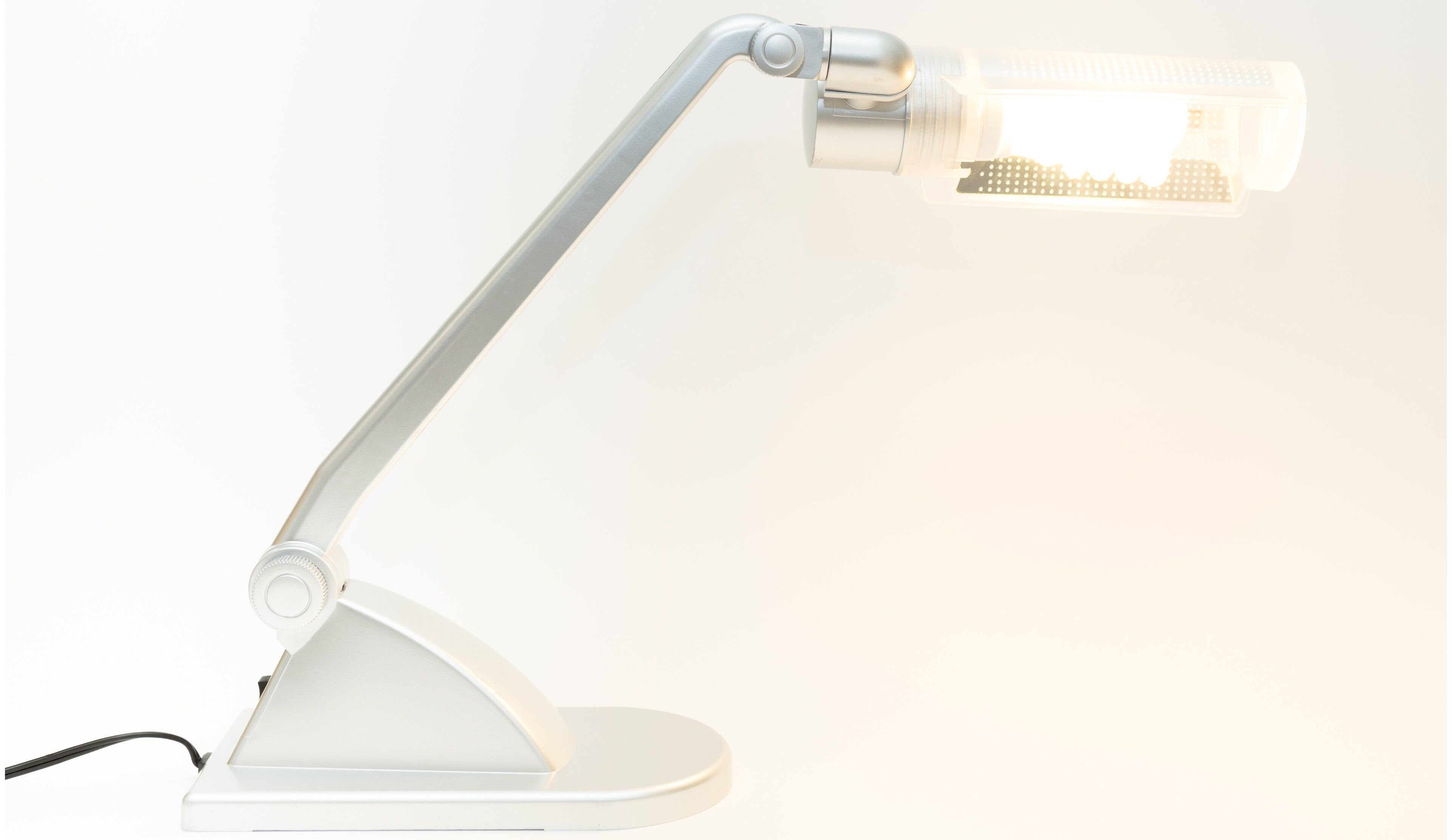 A white desk lamp with a flexible arm and a rectangular light bulb.