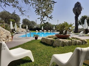 Seasonal outdoor pool, open 10 AM to 6:00 PM, pool loungers