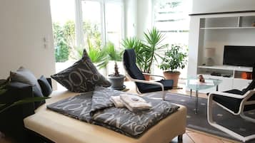 Apartment, 1 Bedroom | Living area | Flat-screen TV, fireplace