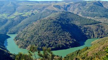 A mountainous landscape with a river.