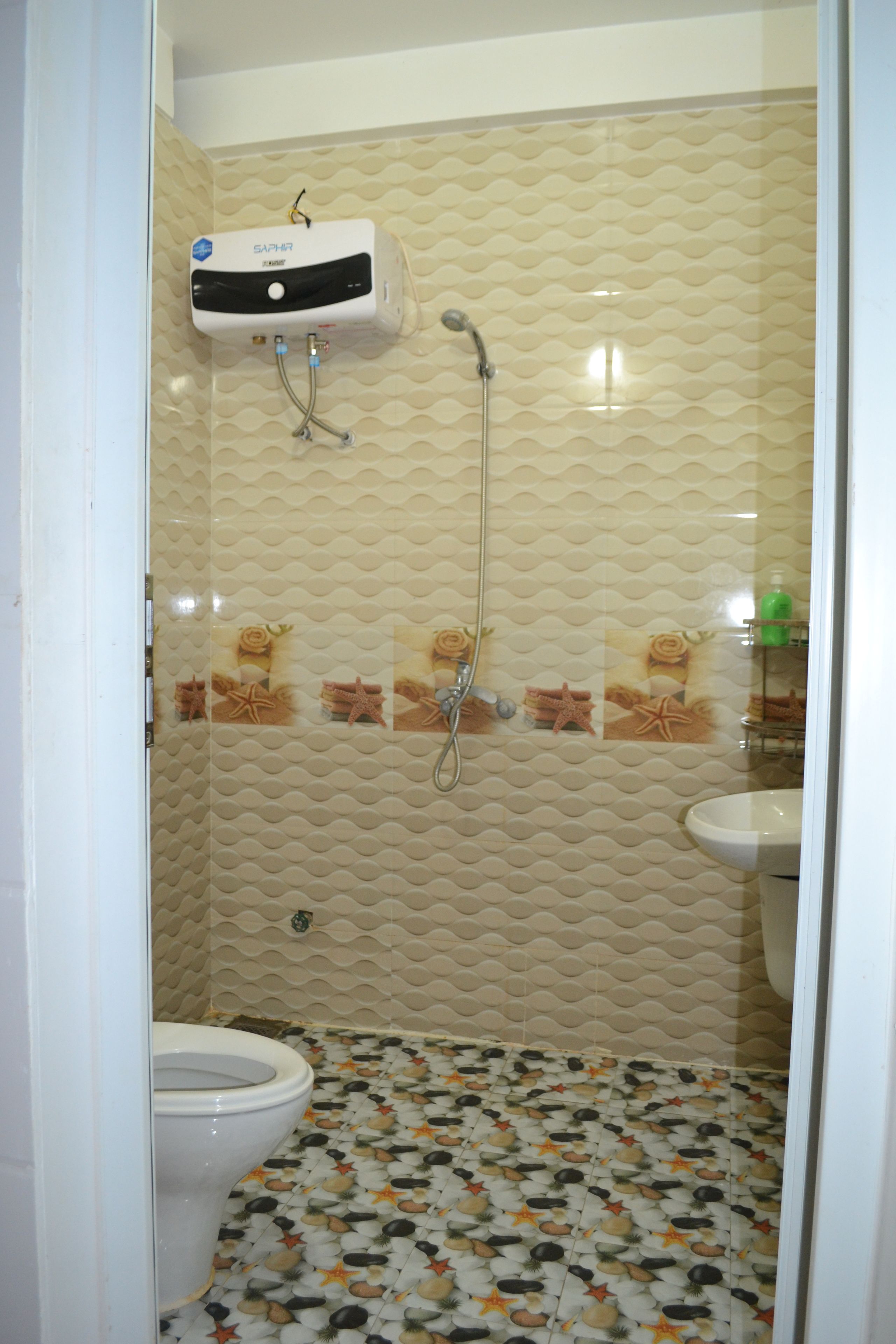 shower, hair dryer, slippers, towels