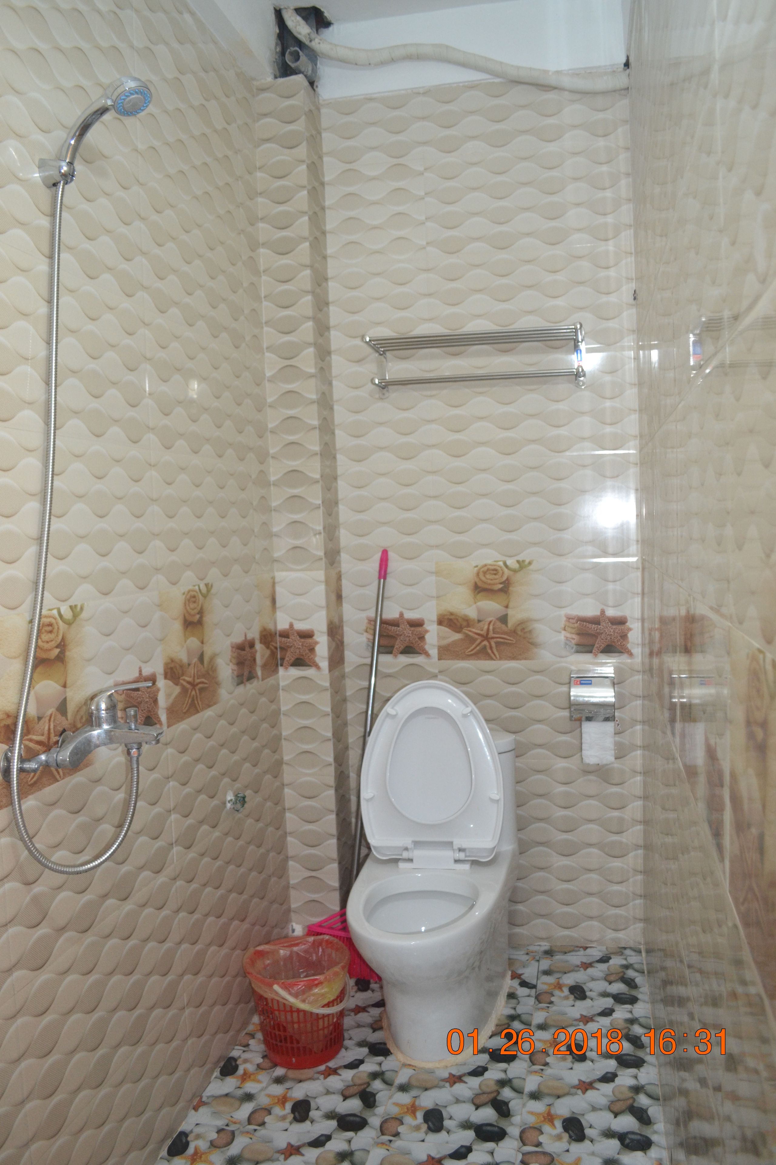 shower, hair dryer, slippers, towels