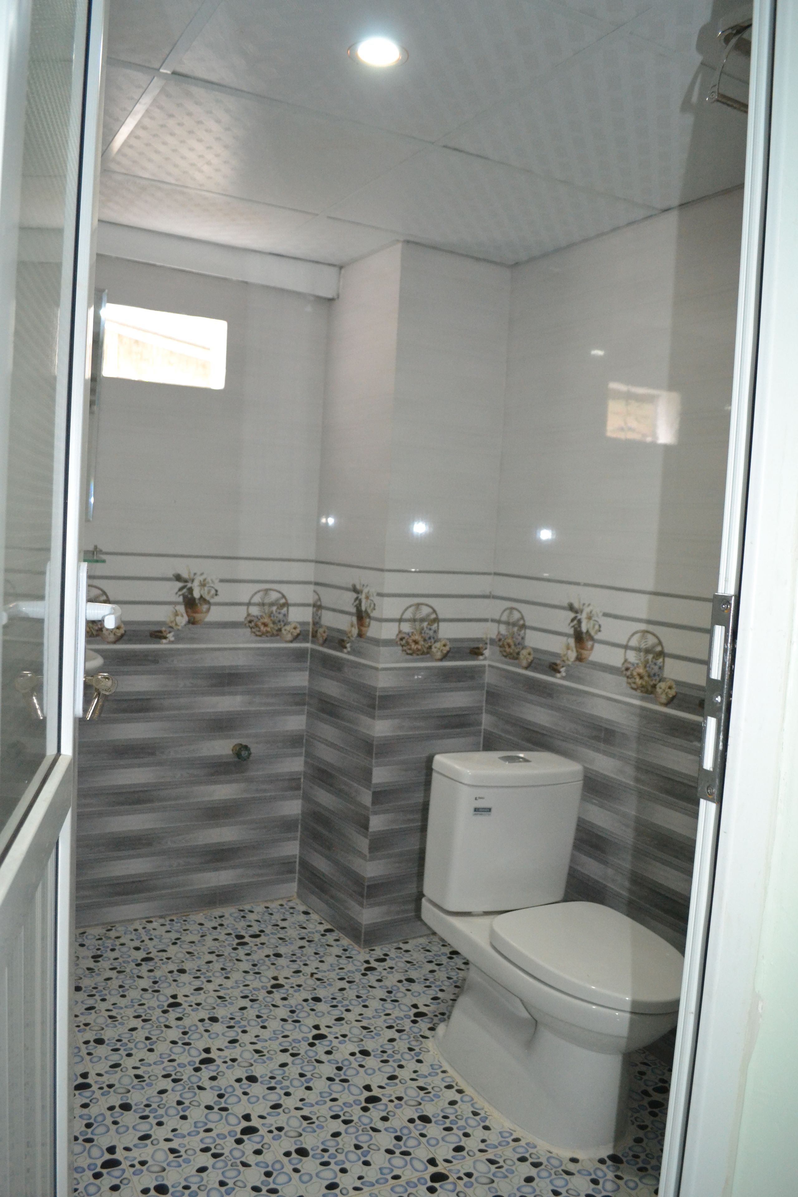 shower, hair dryer, slippers, towels