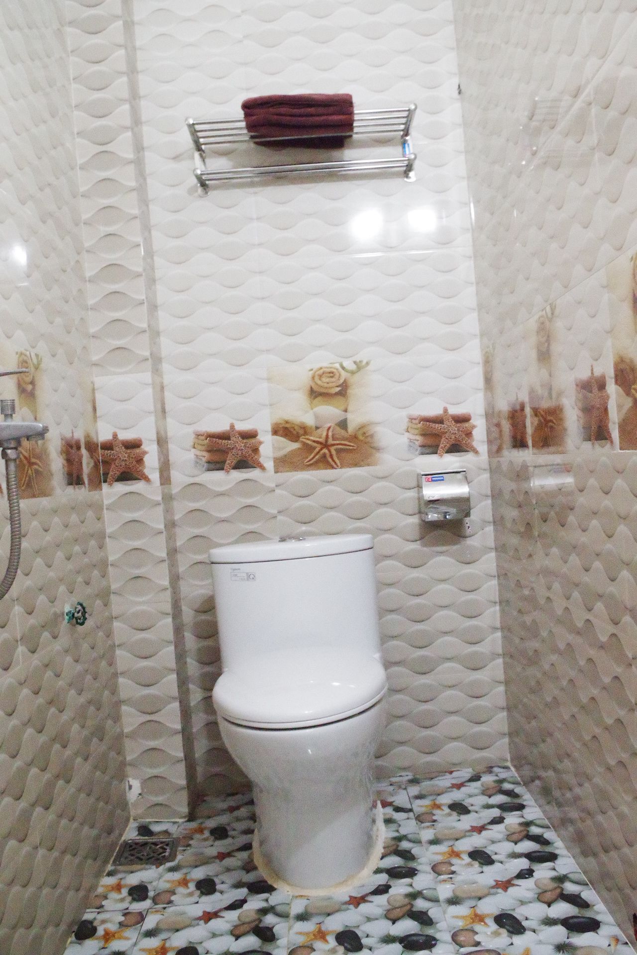 shower, hair dryer, slippers, towels