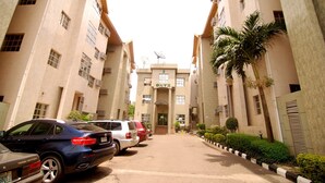 A multi-story building with a central entrance labeled "ONYX". - Onyx Hotel and Apartments (Abuja)