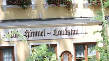 A building with a sign reading "Hotel Himmel - Landshut."