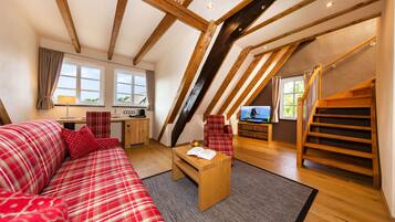 Deluxe Suite (Landhaus) | Living area | 26-inch flat-screen TV with satellite channels