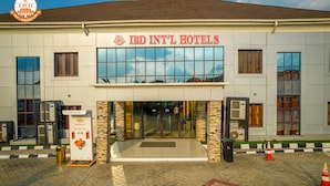 The exterior of IBD INT'L HOTELS with a clear entrance, a reception desk, and a "Stay Safe" sign. - IBD International Hotels Limited (Abeokuta)