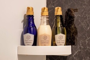 Three bottles of ESTHE ROYER products on a shelf.