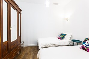 2 bedrooms, blackout drapes, soundproofing, iron/ironing board