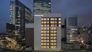 A modern building with a sign for 'karaksa hotel' and a glass facade. - karaksa hotel premier Tokyo Ginza (Tokyo)