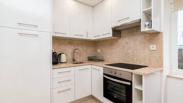 Apartment, 1 Bedroom (27) | Private kitchen | Full-sized fridge, oven, stovetop, coffee/tea maker