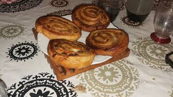 A table with pastries, a glass of water, and a cup of coffee.
