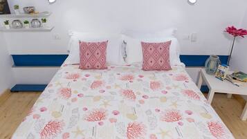 Family Quadruple Room | Minibar, individually decorated, individually furnished, desk