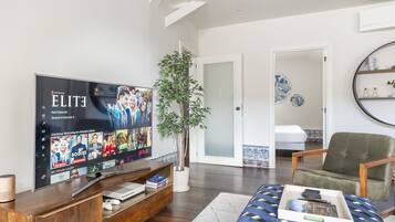 Deluxe Apartment, 3 Bedrooms, 2 Bathrooms, City View | Living area | 55-inch flat-screen TV with cable channels, TV, tablet