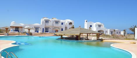 Outdoor pool, pool umbrellas, sun loungers
