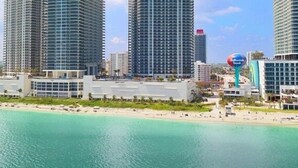 A coastal hotel with high-rise buildings, a beach, and a clear sky. - Lyfe Residence Building - Private apts over the beach (Hollywood)