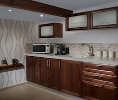 Suite Deluxe, 1 cama de matrimonio con sofá cama, no fumadores | Cocina privada | Frigorífico, microondas, lavavajillas y cafetera o tetera