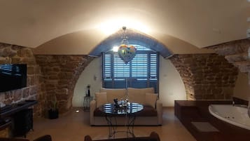 Suite Deluxe, 1 cama Queen size y sofá cama, para no fumadores | Área de sala de estar
