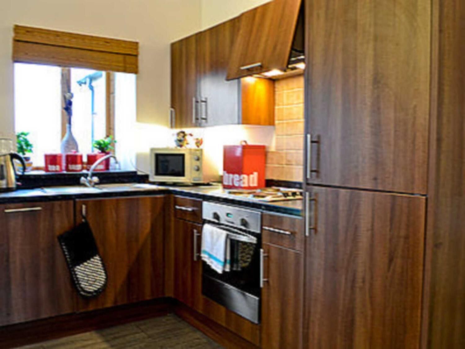 Fridge, microwave, electric kettle, cookware/dishes/utensils