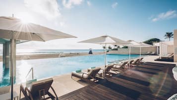 Outdoor pool, free pool cabanas, pool umbrellas