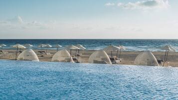 Outdoor pool, free pool cabanas, pool umbrellas