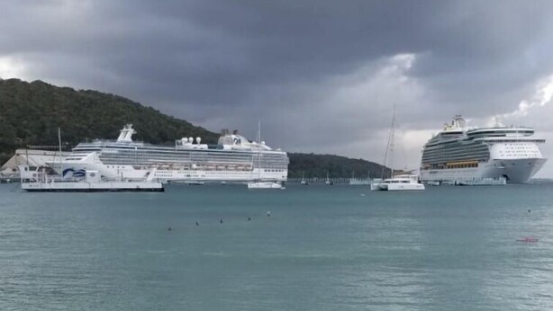 A beach with clear turquoise water and a large cruise ship docked in the background. - Ocho Rios Vacation - Apartment (Ocho Rios)