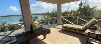The Penthouse with sweeping views of Cocoa bay beach , green turtles & Rays