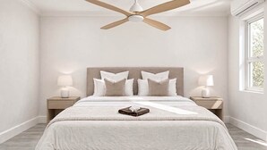 A bedroom with a bed, two bedside tables with lamps, a ceiling fan, and a window. - Lo key cottages-The Penthouse (green turtle cay)