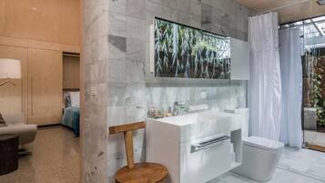 Bathtub, hair dryer, towels, soap