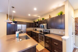 Microwave, dishwasher, coffee/tea maker, cookware/dishes/utensils