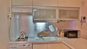 Family House | Private kitchen | Full-size fridge, microwave, stovetop, electric kettle
