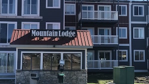 A multi-story building with a sign reading "Mountain Lodge". - 'Slopeside Escape' Mtn Lodge; Looking Directly at Ballhooter!! (Snowshoe)