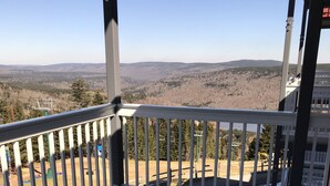 A balcony with a view of a mountainous landscape. - 'Slopeside Escape' Mtn Lodge; Looking Directly at Ballhooter!! (Snowshoe)