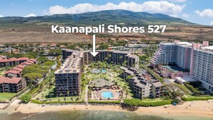 A resort with multiple buildings, a pool, and a beach. - 2Bedroom w Ocean Views in BeachFront Resort - Kaanapali Shores 527 (Lahaina)