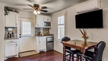 Fridge, microwave, coffee/tea maker, cookware/dishes/utensils