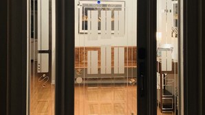 A door with frosted glass panels, a wooden floor, and a welcome sign. - Somewhere... for Birding and Boating (Dunnellon)