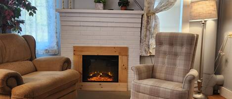 Smart TV, fireplace, books