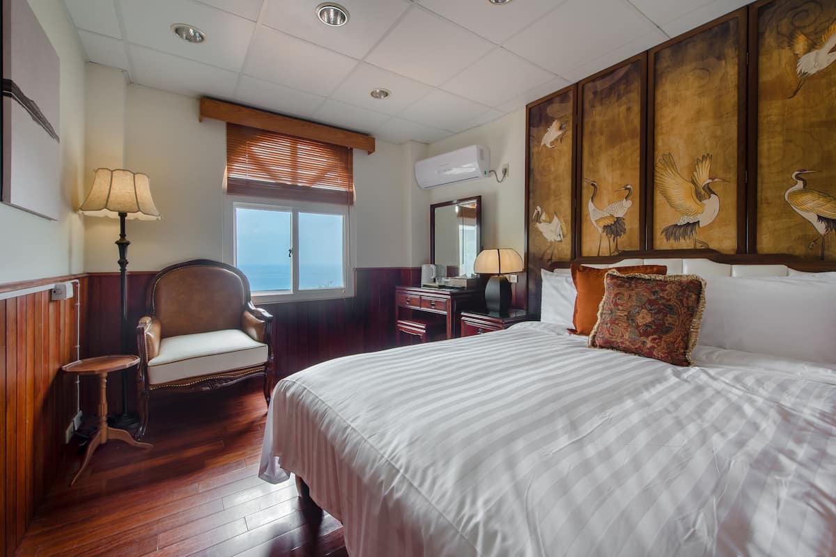 Habitación doble Deluxe, vista al océano | Decoración personalizada, wifi gratis y ropa de cama
