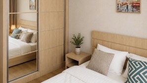Un dormitorio moderno con una cama, una mesita de noche, un espejo y un cuadro en la pared.