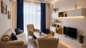 Luxury Apartment, 2 Bedrooms, Mountain View | Living area | Flat-screen TV