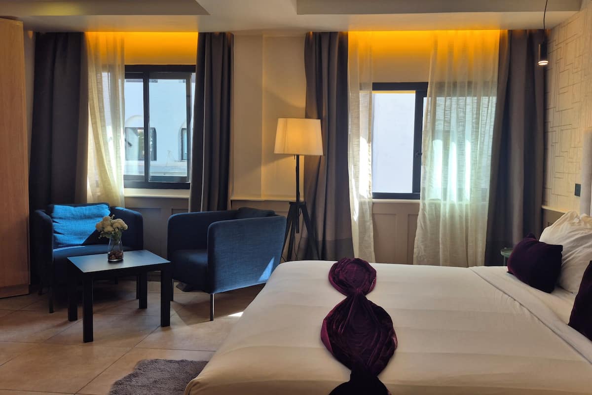 Deluxe Room, City View | Premium bedding, minibar, in-room safe, individually decorated